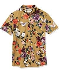 Camisa beige de manga corta con estampado floral